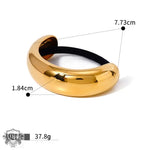 Gold-colored 18K gold hair tie featuring a double-layer design, ideal hair accessories