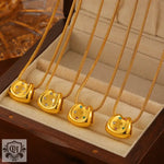 Four 18K gold necklaces featuring horseshoe-shaped pendants in light luxury style