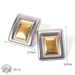 Two-tone square stud earrings featuring 18K gold in a trendy rectangular design