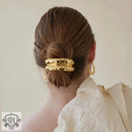 Golden hammered-texture hair cuff as part of 18K gold trendy hair accessories collection