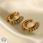 Gold hoop earrings featuring embedded crystals and 18K Gold White Square Zircon design