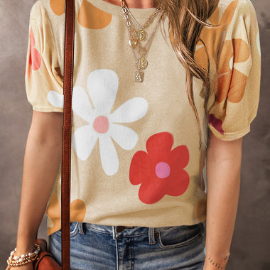 Beige puff-sleeve top with floral print styled with jeans and a brown bag in Euro sizes