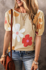 Beige puff-sleeve top with floral print styled with jeans and a brown bag in Euro sizes