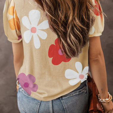 Beige floral t-shirt with bubble sleeves and flower prints paired with blue jeans in Euro sizes