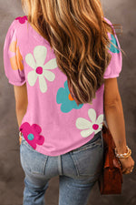 Pink floral print t-shirt with puff sleeves styled with blue jeans in Euro sizes