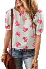 White blouse with pink bow prints and puff sleeves, styled with blue jeans in Euro sizes