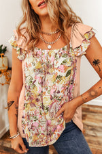 Floral ruffled blouse in apricot pink with blooms, perfect for all sizes and styles