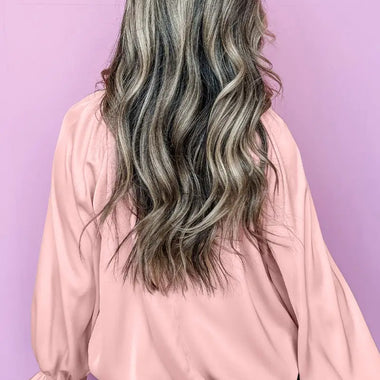 Long wavy silver-gray hair with curls styled with Apricot Pink Pleated Blouse in UK sizes