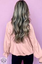 Long wavy silver-gray hair with curls styled with Apricot Pink Pleated Blouse in UK sizes