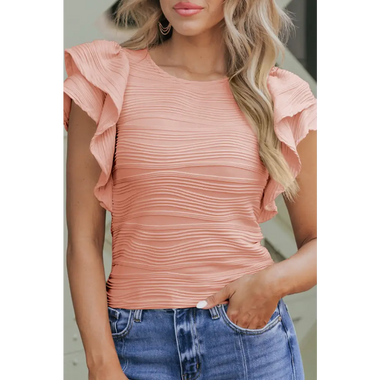 Peach-colored ruched top with ruffled cap sleeves and blue jeans in Euro sizes