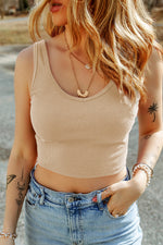 Beige ribbed crop tank top with light wash jeans, featuring optimal bust hem width