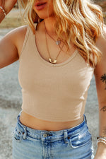 Beige Ribbed Knit Sheath Sleeveless Crop Top paired with light wash denim jeans for a relax look