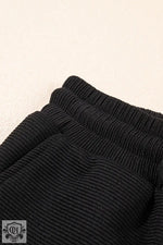 Black ribbed knit pants for a comfortable look with the Apricot Textured Ruffled Set