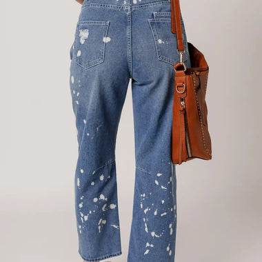 Blue splatter-painted Ashleigh jeans featuring a rope waist and ripped detail