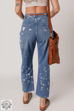 Blue splatter-painted Ashleigh jeans featuring a rope waist and ripped detail