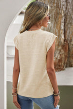 Sleeveless beige textured top with crew neckline for relaxed style in various sizes