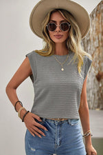 Sleeveless gray textured top with distressed denim, beige hat, round sunglasses, sizes available