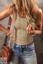 Beige textured tank top with blue denim jeans and brown leather bag, sizes bust waist