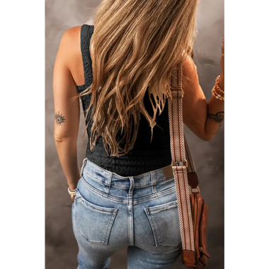 Back view of a person in a black tank top showing tattoos, highlighting bust waist fit