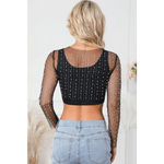 Black mesh long-sleeved crop top with rhinestone details paired with denim jeans in sizes bust sleeve