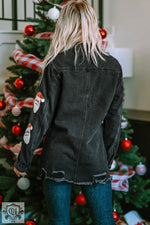 Distressed black denim jacket with Santa Claus patches for a relaxed holiday look