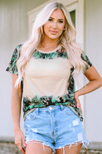 Tie-dye green and white t-shirt with distressed denim shorts for stylish relaxation