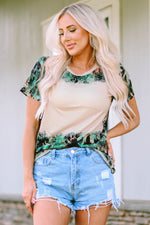 Casual summer outfit with floral t-shirt and distressed denim shorts for relaxed style