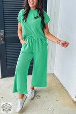 Woman in green pleated pantsuit featuring Bright Green Solid Corded Knit set