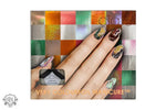 Manicured fingernails with glittery designs from Ciate Colourfoil Manicure Wonderland Presentset