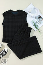 Black textured knit cap sleeve T-shirt and wide-leg pants set for a relaxed style