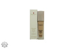 Beige Elizabeth Arden Flawless Finish Skincaring Foundation bottle with white box