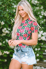 Person showcasing Fiery Red Retro Floral Print Crew Neck T Shirt with distressed denim shorts