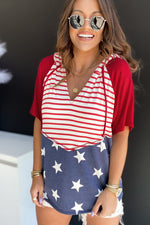 Patriotic red, white, and blue romper with stars and stripes patterns for relaxed fit