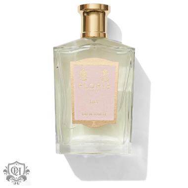 Clear glass perfume bottle with gold cap and pink label for Floris Lily Eau de Toilette