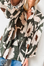 Flowy Four Leaf Clover Abstract Floral Print Blouse in green, white, and brown tones