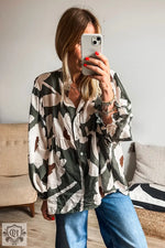 Abstract patterned Four Leaf Clover blouse in black, white, and brown for relaxed fit