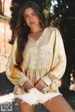 Cream-colored peasant blouse with puffy sleeves, perfect for a relaxed look