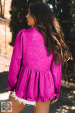 Bright magenta ruffled blouse with long sleeves and gathered waist for stylish relaxation