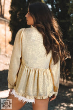 Gold Metallic Frilled Blouse featuring cream-colored ruffled design and long sleeves