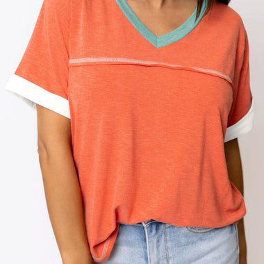 Coral V-neck T-shirt with turquoise trim and white accents for relax relax styles