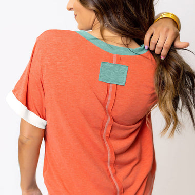 Coral-colored Grapefruit Orange Contrast Trim T-shirt with white trim, available in Euro sizes