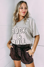 Casual Rock & Roll graphic tee with dark denim shorts, perfect for a relaxed look