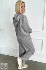 Gray quilted tracksuit featuring a drawstring hoodie and wide leg pants for relaxed comfort