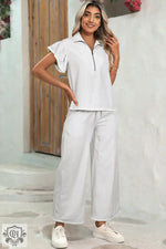 Woman wearing a Gray Stripe Zipped Collar Ruffled Sleeve Tee and Wide Leg Pants outfit