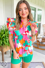 Vibrant pink, turquoise, and orange floral sleeveless blouse with green shorts, relax relax