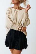 Cream-colored sweater and flowy black mini skirt for Relax Relax Relax styles in euro sizes