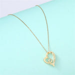 Exquisite Hollow Heart Zircon Pendant Necklace: A Luxurious Gift for Mom -  QH Clothing