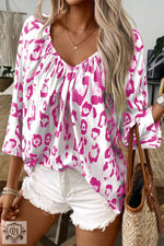 Flowy white and pink leopard print blouse with v-neckline in sizes UK sizes, Euro sizes