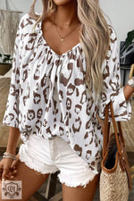 White and brown leopard print blouse in sizes UK sizes featuring a v-neckline and 3/4 sleeves