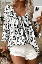 Flowy white and black leopard print blouse in sizes UK sizes, perfect for relaxed style